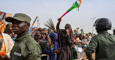 Nigerien Police officers stand guard as supporters of Niger&#039;s National Council of Safeguard of the Homeland (CNSP) protest outside the Niger and French airbase, Niamey, Niger, Aug. 30, 2023. (AFP Photo)