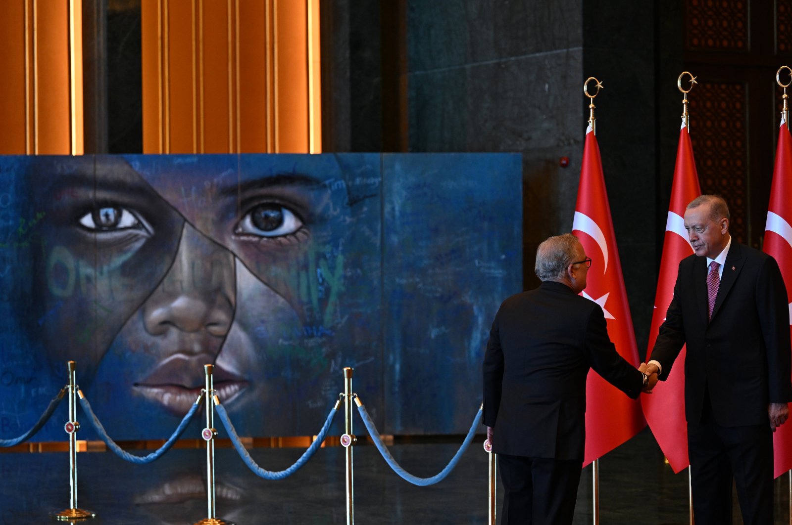 President Recep Tayyip Erdoğan received congratulations in front of the “Refugee Kid”-themed painting, drawn specially for 2016&#039;s World Humanitarian Summit, Ankara, Türkiye, Aug. 30, 2023. (AA Photo)