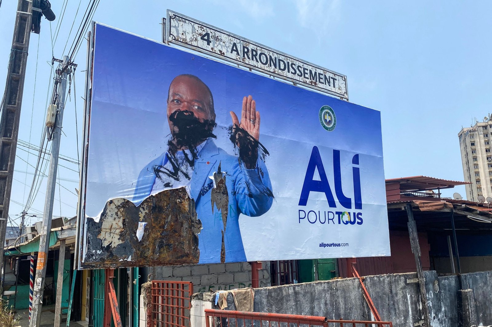 A general view of a defaced campaign billboard of ousted Gabon President Ali Bongo Ondimba, Libreville, Gabon, Aug. 31, 2023. (AFP Photo)