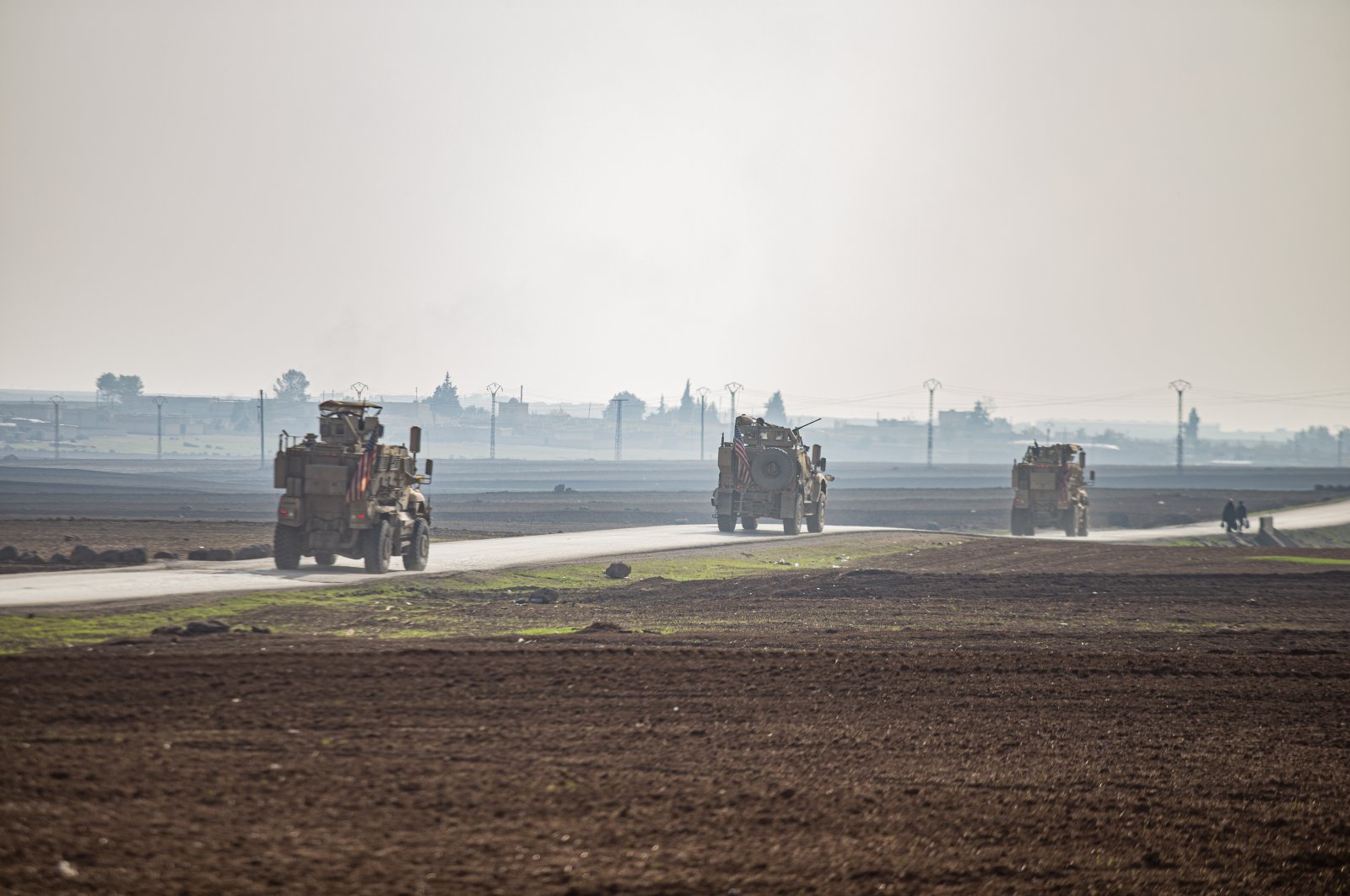  U.S. military vehicles on a patrol in the countryside near the town of Qamishli, Syria, Sunday, Dec. 4, 2022. (AP File Photo)