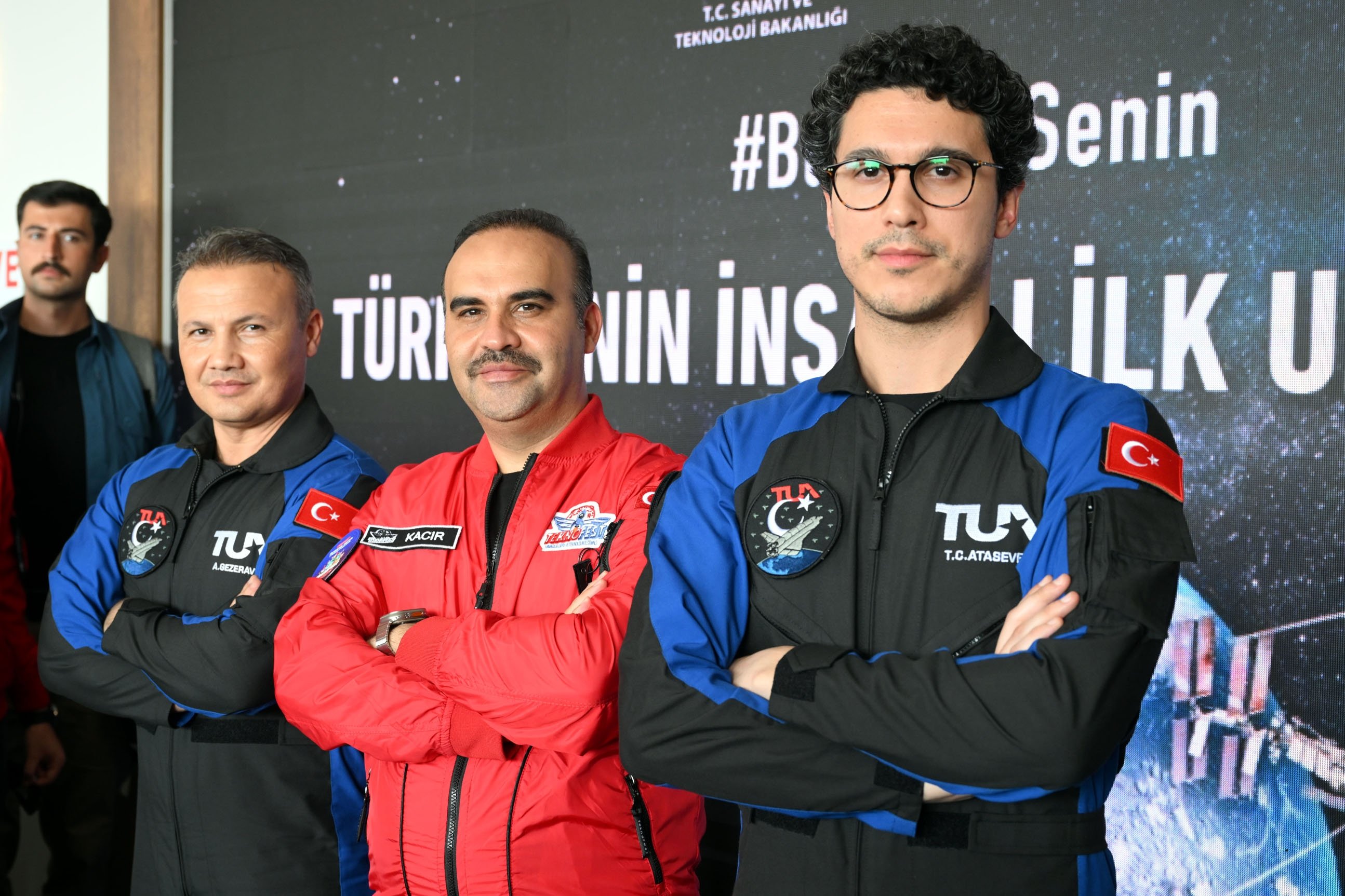 Industry and Technology Minister Mehmet Fatih Kacır (C) poses next to Türkiye's first space travelers Alper Gezeravcı (L) and Tuva Cihangir Atasever in Ankara, Türkiye, Sept. 2, 2023. (DHA Photo)