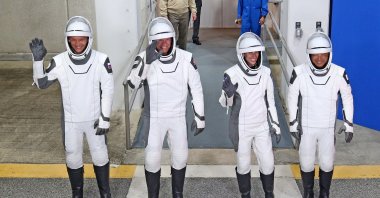 (From L) Roscosmos cosmonaut Konstantin Borisov, European Space Agency (ESA) astronaut Andreas Mogensen, NASA astronaut Jasmin Moghbeli, and Japan Aerospace Exploration Agency (JAXA) astronaut Satoshi Furukawa wearing SpaceX spacesuits wave as they prepare to depart, Cape Canaveral, Florida, U.S., August 26, 2023.. (AFP Photo)
