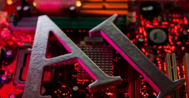 Artificial Intelligence letters on computer motherboard in an illustration dated June 23, 2023. (Reuters Photo)