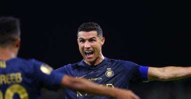 Al-Nassr's Cristiano Ronaldo (R) celebrates after scoring a goal during the Saudi Pro League football match against Al-Hazm at the King Abdullah Sports City, Buraidah, Saudi Arabia, Sept. 2, 2023. (AFP Photo)