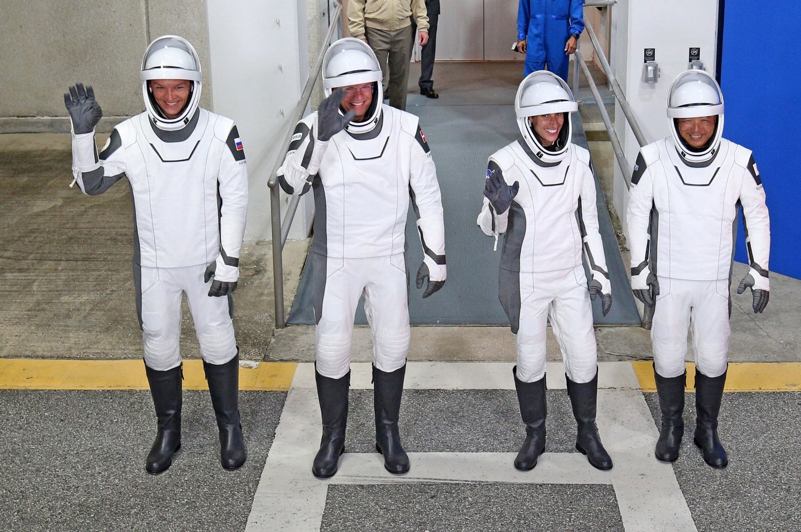 (From L) Roscosmos cosmonaut Konstantin Borisov, European Space Agency (ESA) astronaut Andreas Mogensen, NASA astronaut Jasmin Moghbeli, and Japan Aerospace Exploration Agency (JAXA) astronaut Satoshi Furukawa wearing SpaceX spacesuits wave as they prepare to depart, Cape Canaveral, Florida, U.S., August 26, 2023.. (AFP Photo)