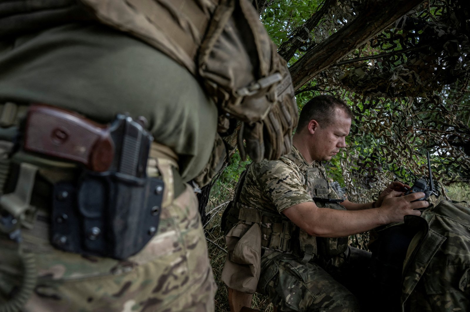 A Ukrainian serviceman operates an FPV drone from his positions at a front line near the village of Robotyne, Zaporizhzhia region, Ukraine, Aug. 25, 2023. (Reuters Photo)