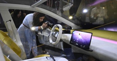 Visitors take pictures of a study of the "Neue Klasse" (New Class) project, the new electric vehicle concepts, seen during a preview event of the opening of the Munich Motor Show (IAA) in Munich, Germany, Sept. 2, 2023. (AFP Photo)