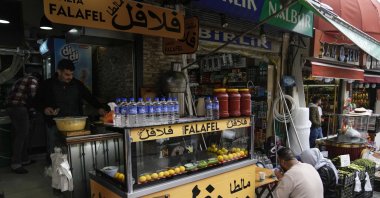 Costumers eat in a Syrian restaurant at Fatih district of Istanbul, Türkiye, April 29, 2023. (AP Photo)