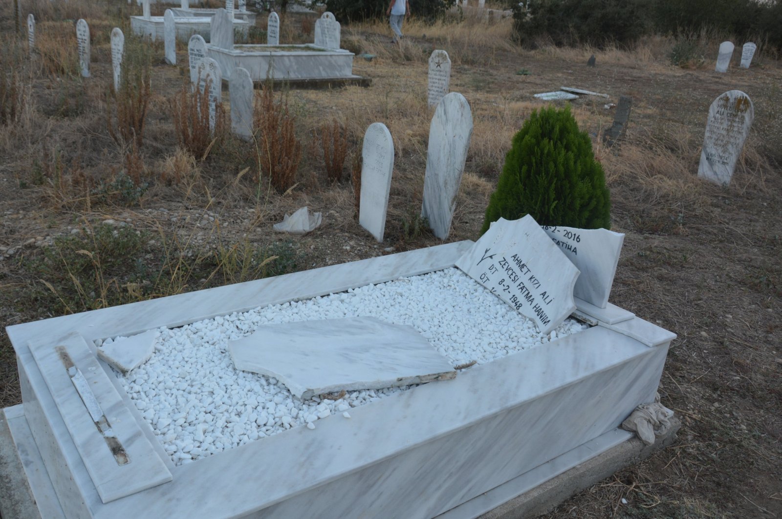 The tombstone of a Turkish person lies wrecked after a group of unidentified people attacked a Turkish minority cemetery in the Western Thracian village of Polianthos (Narlıköy), Greece, Sept. 3, 2023. (AA Photo)