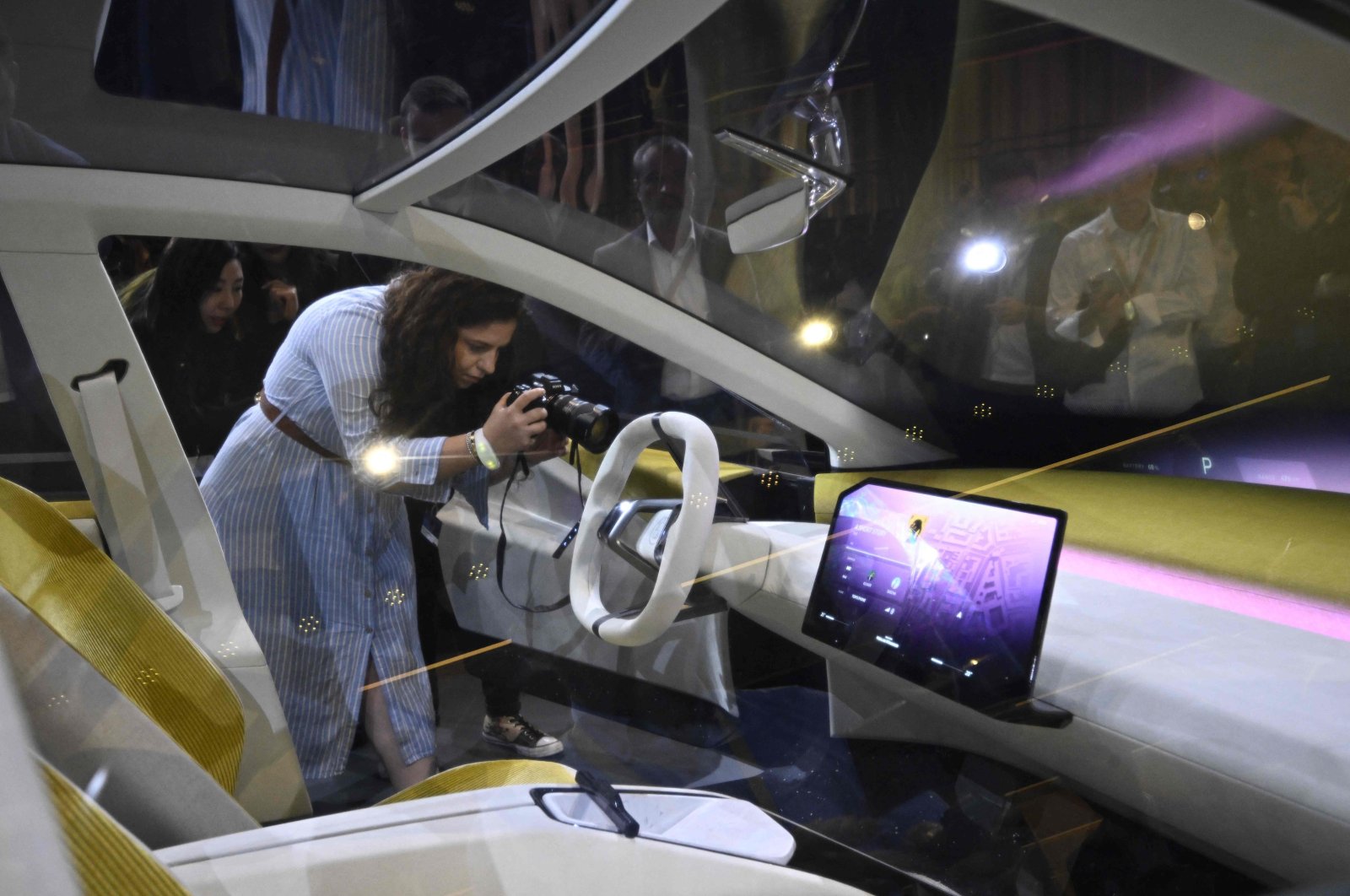 Visitors take pictures of a study of the "Neue Klasse" (New Class) project, the new electric vehicle concepts, seen during a preview event of the opening of the Munich Motor Show (IAA) in Munich, Germany, Sept. 2, 2023. (AFP Photo)