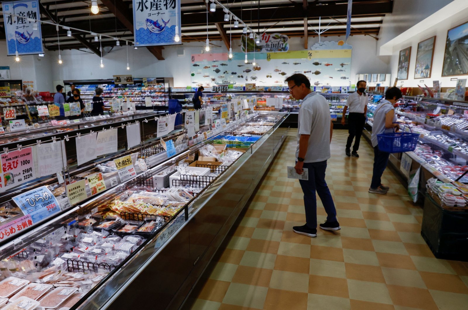 Customers browse through locally caught seafood at the Hamanoeki Fish Market and Food Court in Soma, Fukushima Prefecture, Japan, Aug. 31, 2023. (Reuters Photo)