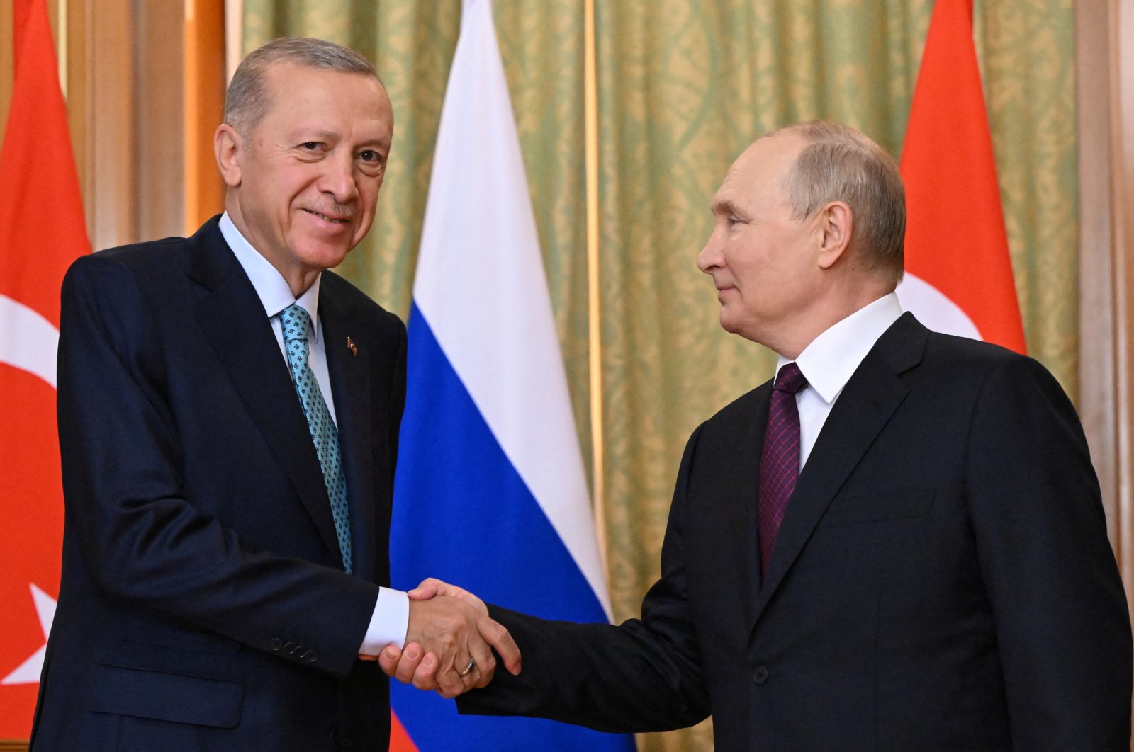 President Recep Tayyip Erdoğan (L) shakes hands with Russian President Vladimir Putin during a meeting in Sochi, Russia, Sept. 4, 2023. (Reuters Photo)