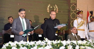 Pakistan&#039;s caretaker Prime Minister Anwaar-ul-Haq Kakar takes the oath from Pakistan&#039;s President Arif Alvi, in Islamabad, Pakistan Aug. 14, 2023. (Press Information Department Handout via Reuters)