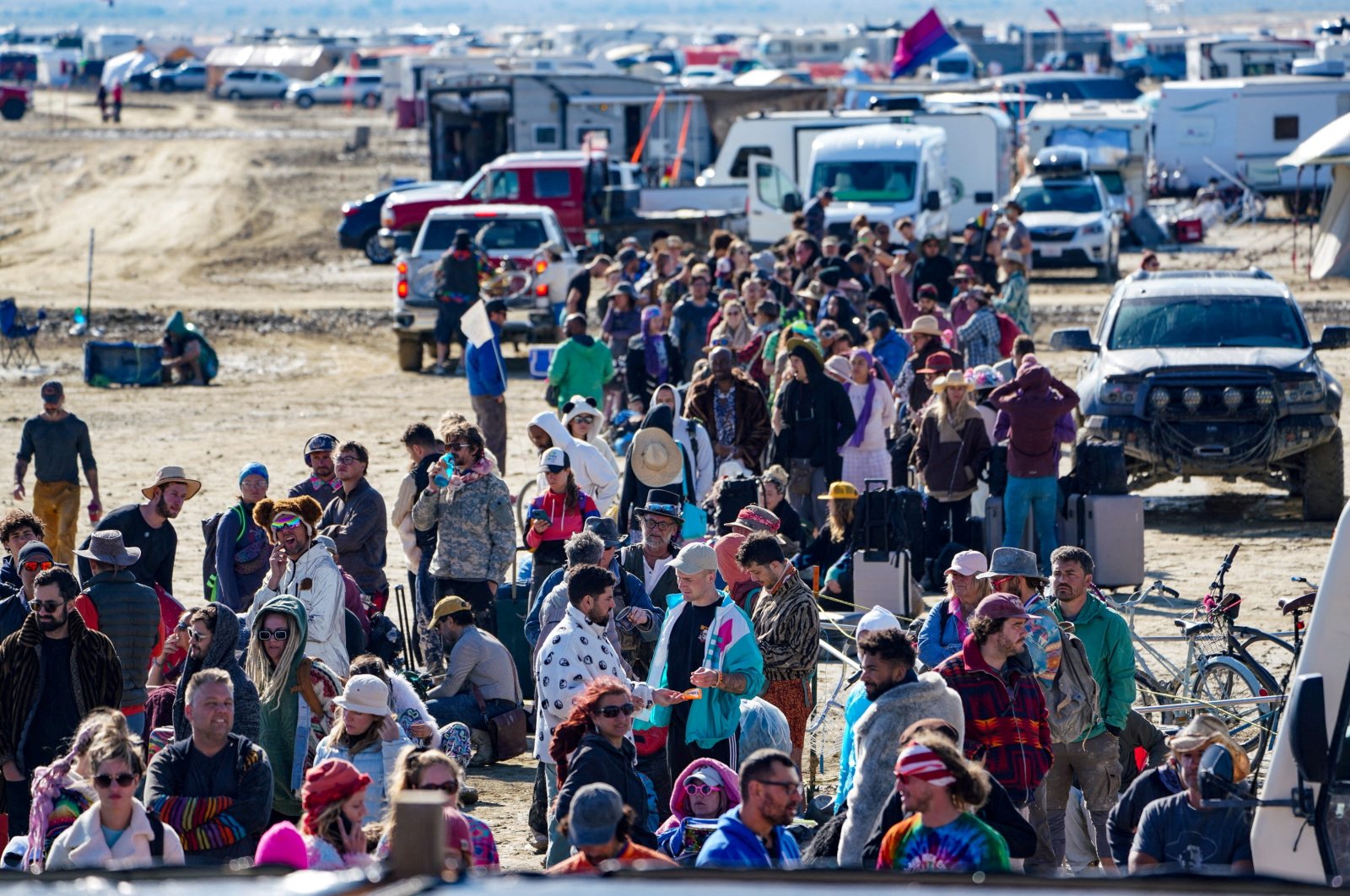 Hundreds of Burning Man attendees who planned to leave on buses wait for information about when they will be able to leave on Labor Day, after a rainstorm turned the site into mud, Nevada, U.S., Sept. 4, 2023. (Reuters Photo)