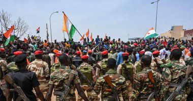 Nigerien soldiers stand guard as supporters of Niger's National Council of Safeguard of the Homeland (CNSP) protest outside the Niger and French airbase in Niamey, Niger, Sept. 2, 2023. (AFP Photo)