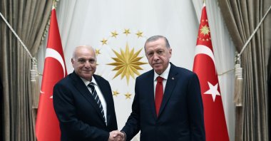 President Recep Tayyip Erdoğan shakes hands with Algerian Foreign Minister Ahmed Attaf in Ankara, Sept. 6, 2023. (IHA Photo)