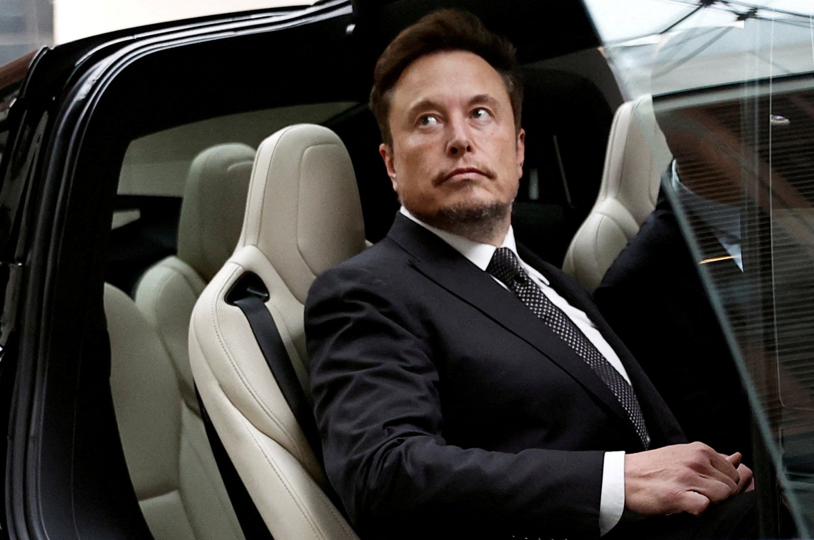 Tesla Chief Executive Officer Elon Musk gets in a Tesla car as he leaves a hotel in Beijing, China, May 31, 2023. (Reuters Photo)