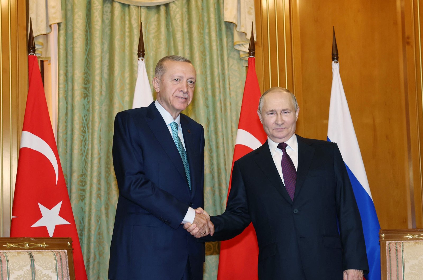 President Recep Tayyip Erdoğan (L) shakes hand with Russian President Vladimir Putin during their meeting in Sochi, Russia, Sept. 4, 2023. (AFP Photo)