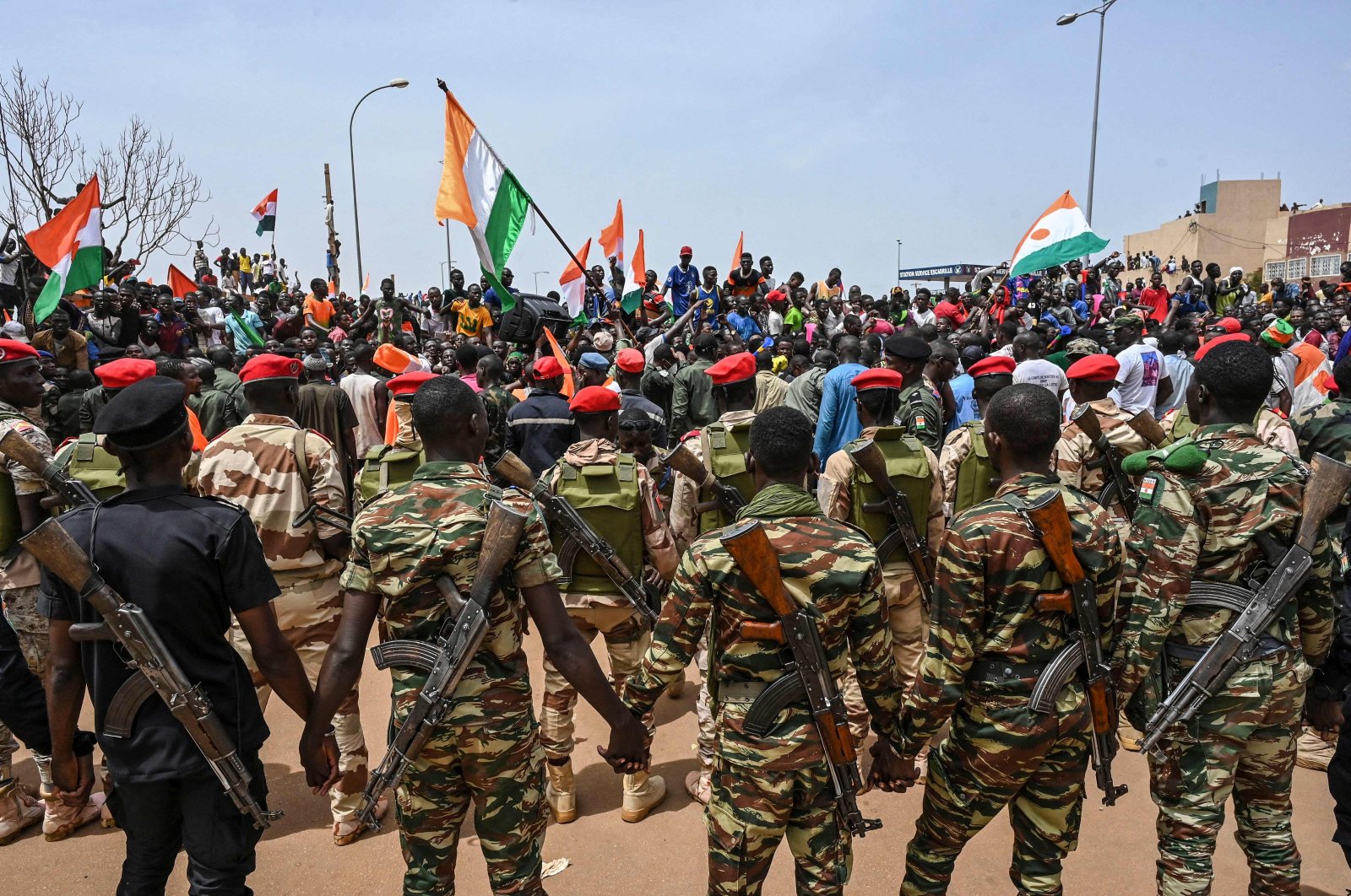 Nigerien soldiers stand guard as supporters of Niger&#039;s National Council of Safeguard of the Homeland (CNSP) protest outside the Niger and French airbase in Niamey, Niger, Sept. 2, 2023. (AFP Photo)