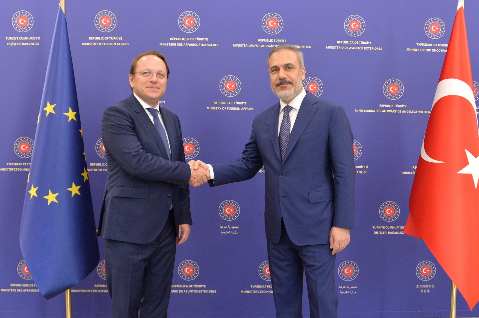 Foreign Minister Hakan Fidan (R) and European Commissioner for Neighborhood and Enlargement Oliver Varhelyi pose for the media before their meeting in the capital Ankara, Türkiye, Sept. 6, 2023. (EPA Photo)