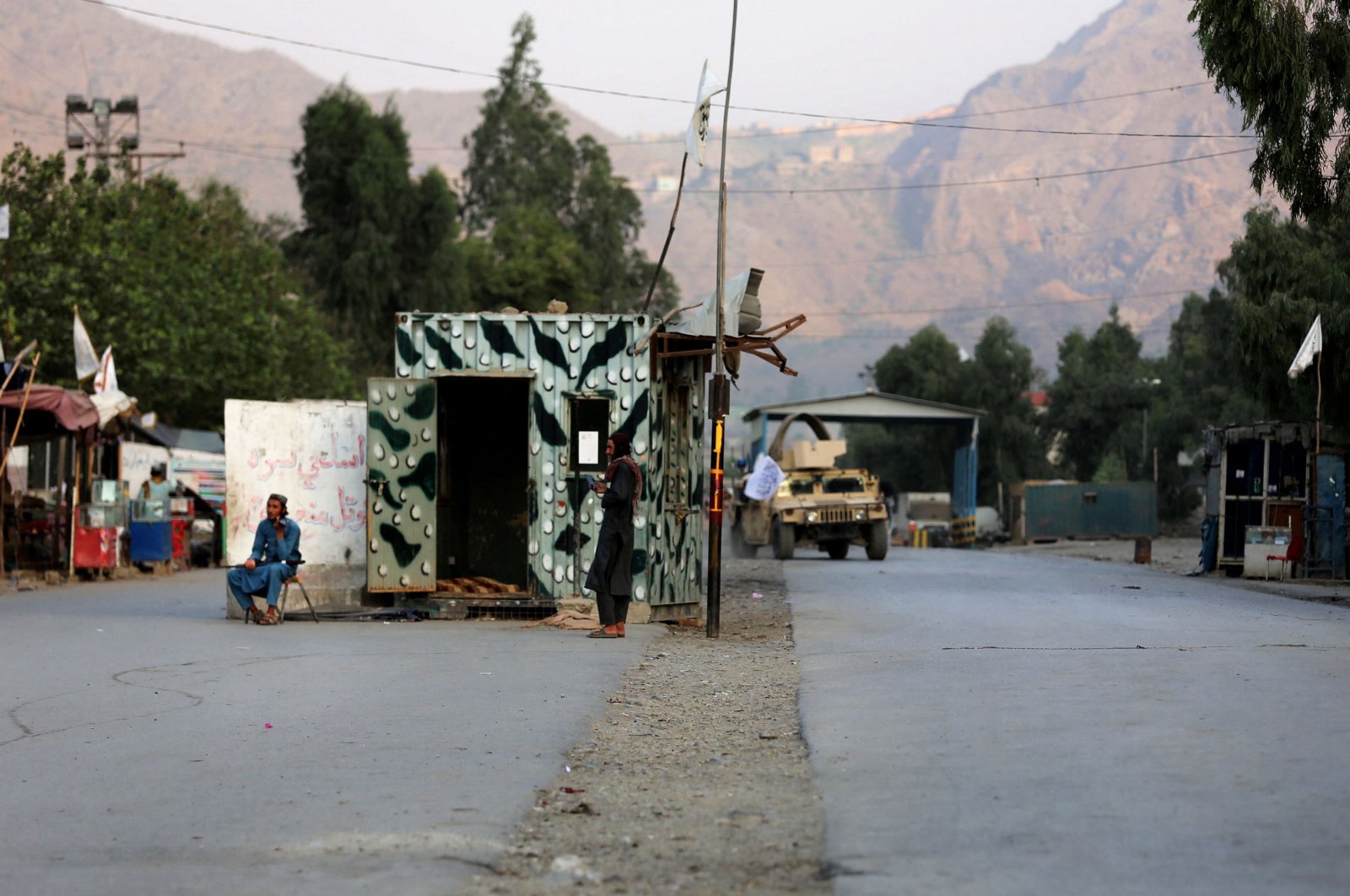 Taliban security personnel stand guard near the closed gates of Torkham border crossing between Afghanistan and Pakistan in Afghanistan&#039;s eastern Nangarhar province on Sept. 6, 2023. (AFP Photo)