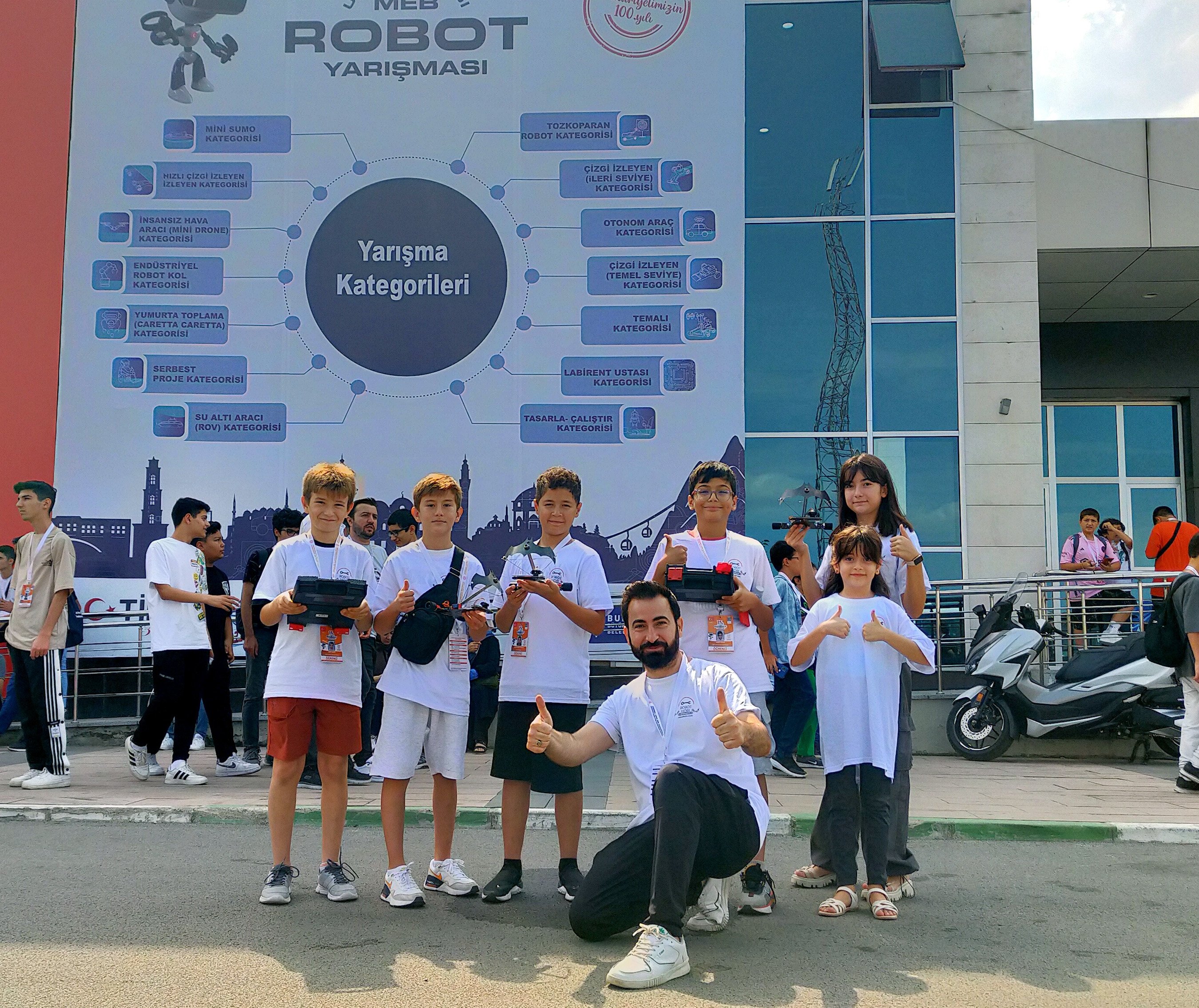 Students pose with their robots at 15th International MEB Robot Competition, Bursa, Türkiye, Sept. 07, 2023. (DHA Photo)