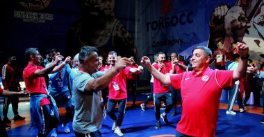 The Turkish wrestling team and a staff member dance to "Erik Dali" after winning at the 7th Deaf World Wrestling Championships, Bishkek, Kyrgyzstan, Sept. 6, 2023. (AA Photo)