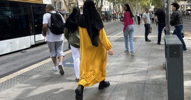 A woman wearing an abaya dress walks in the streets of Marseille, southern France, Aug. 29, 2023. (AFP Photo)