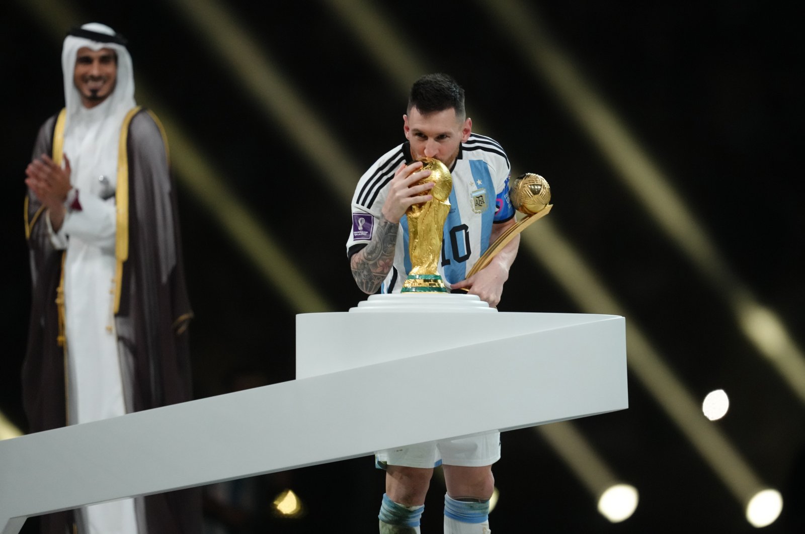 Argentina&#039;s Lionel Messi gives a kiss to the World Cup trophy after beating France in a penalty shootout during the FIFA World Cup final at Lusail Stadium, Lusail, Qatar, Dec. 18, 2022. (Getty Images Photo)