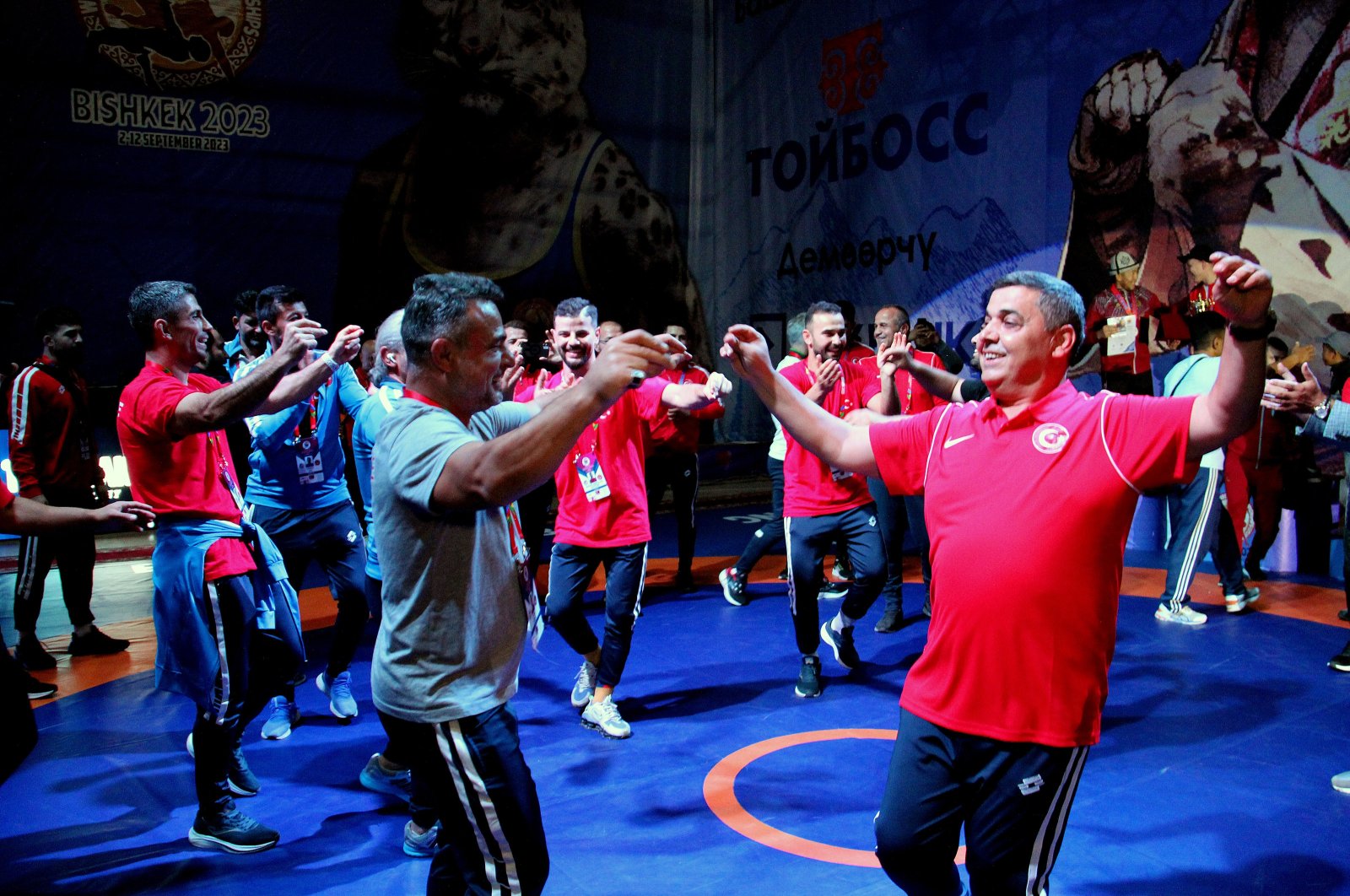 The Turkish wrestling team and a staff member dance to "Erik Dali" after winning at the 7th Deaf World Wrestling Championships, Bishkek, Kyrgyzstan, Sept. 6, 2023. (AA Photo)