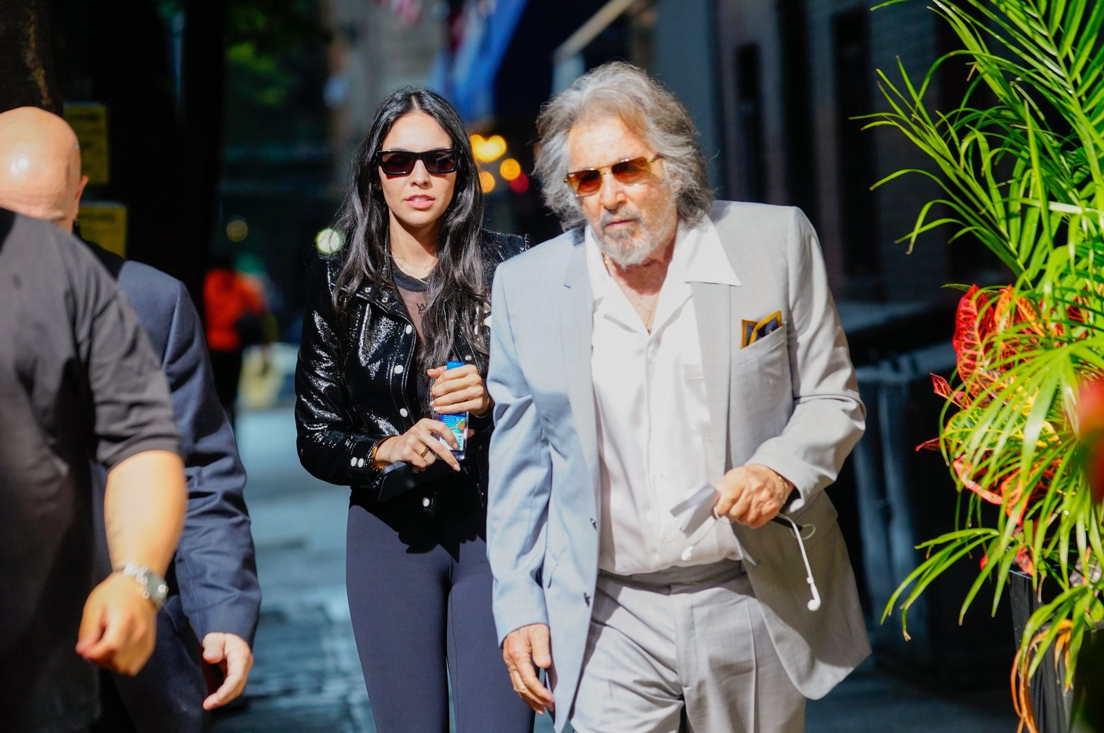 Noor Alfallah and Al Pacino arrive for a music video shoot with Bad Bunny, New York, U.S., Aug. 24, 2023. (Getty Images Photo)