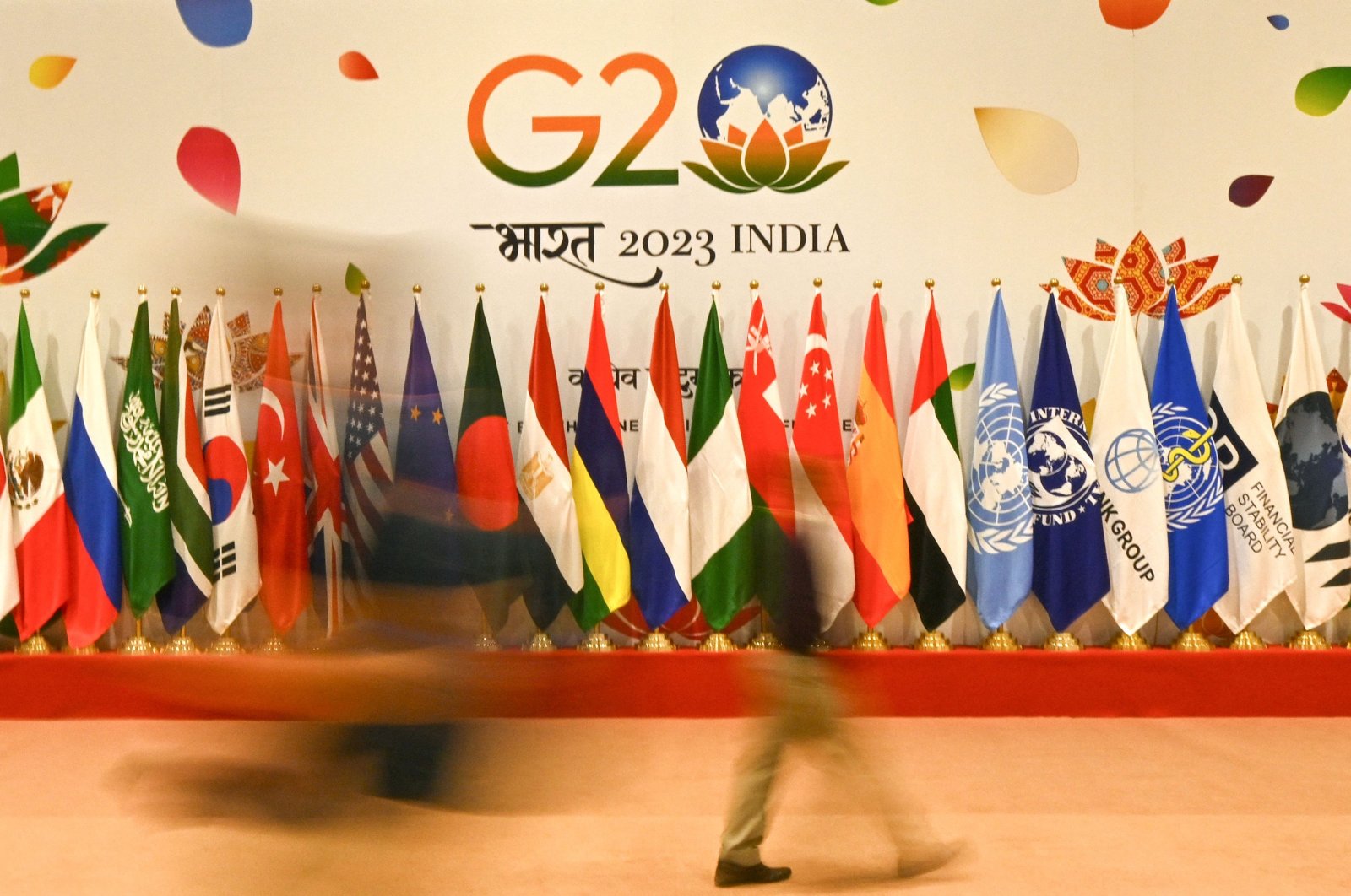 Flags of participating countries are pictured inside the International media centre at the G20 venue, days ahead of its commencement in New Delhi on September 7, 2023. (Photo by Money SHARMA / AFP)