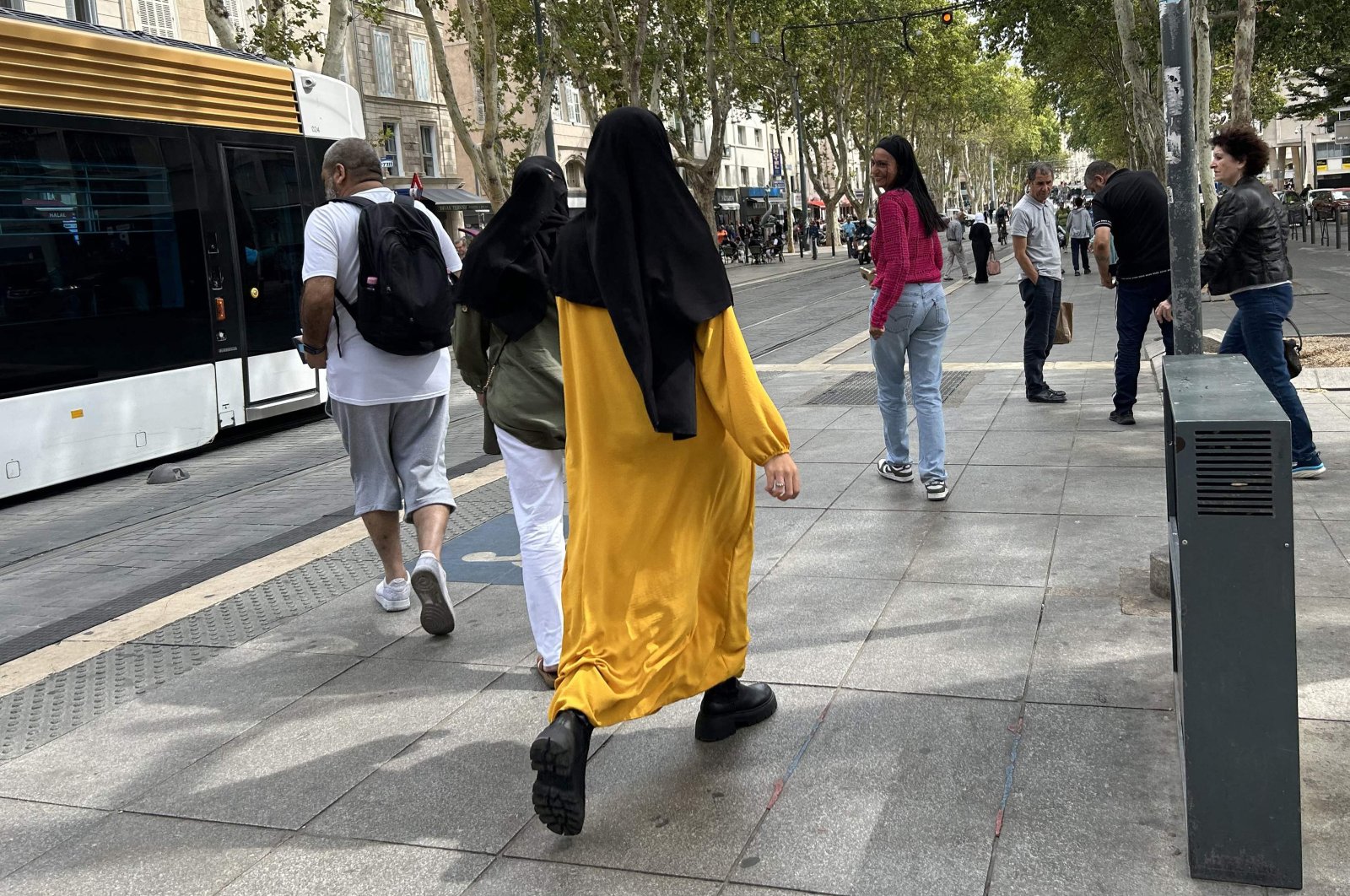 A woman wearing an abaya dress walks in the streets of Marseille, southern France, Aug. 29, 2023. (AFP Photo)