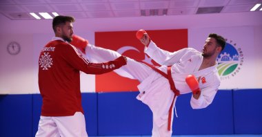 Turkish karateka shows off his abilities (R) during training at the Sakarya Metropolitan Municipality Sports Club, Sakarya, Türkiye, Sept. 4, 2023. (AA Photo)