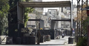 Lebanese army soldiers stand guard at the entrance of Ain el-Hilweh Palestinian refugee camp after clashes between supporters of the Fatah movement and rival groups erupted, in Sidon, Lebanon, Sept. 8, 2023. (EPA Photo)