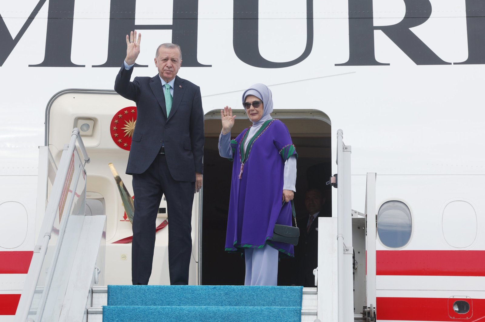 President Recep Tayyip Erdoğan waves as he boards the flight for India with first lady Emine Erdoğan, in the capital Ankara, Türkiye, Sept. 8, 2023. (AA Photo)