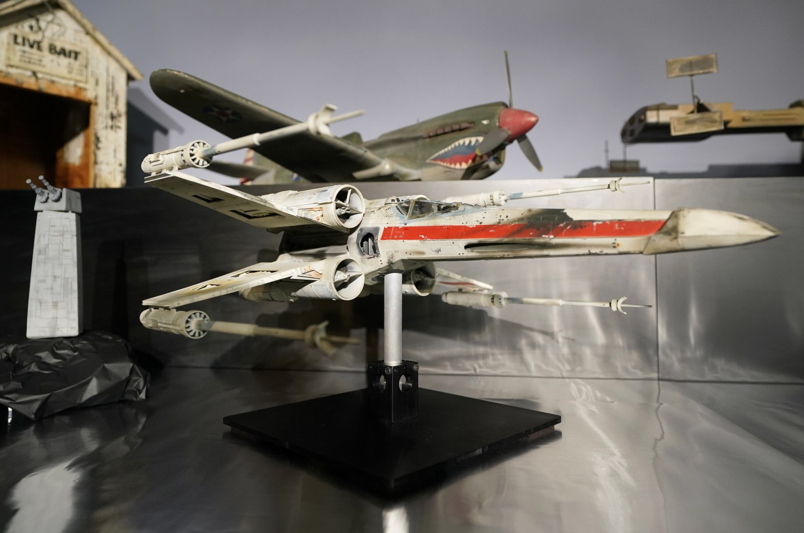 A miniature model called &quot;Red Leader&quot;, a X-wing starfighter from the 1977 film, Star War, Episode IV, A New Hope, on display at Heritage Auctions, in Irving, Texas, U.S., Aug. 30, 2023. (AP Photo)