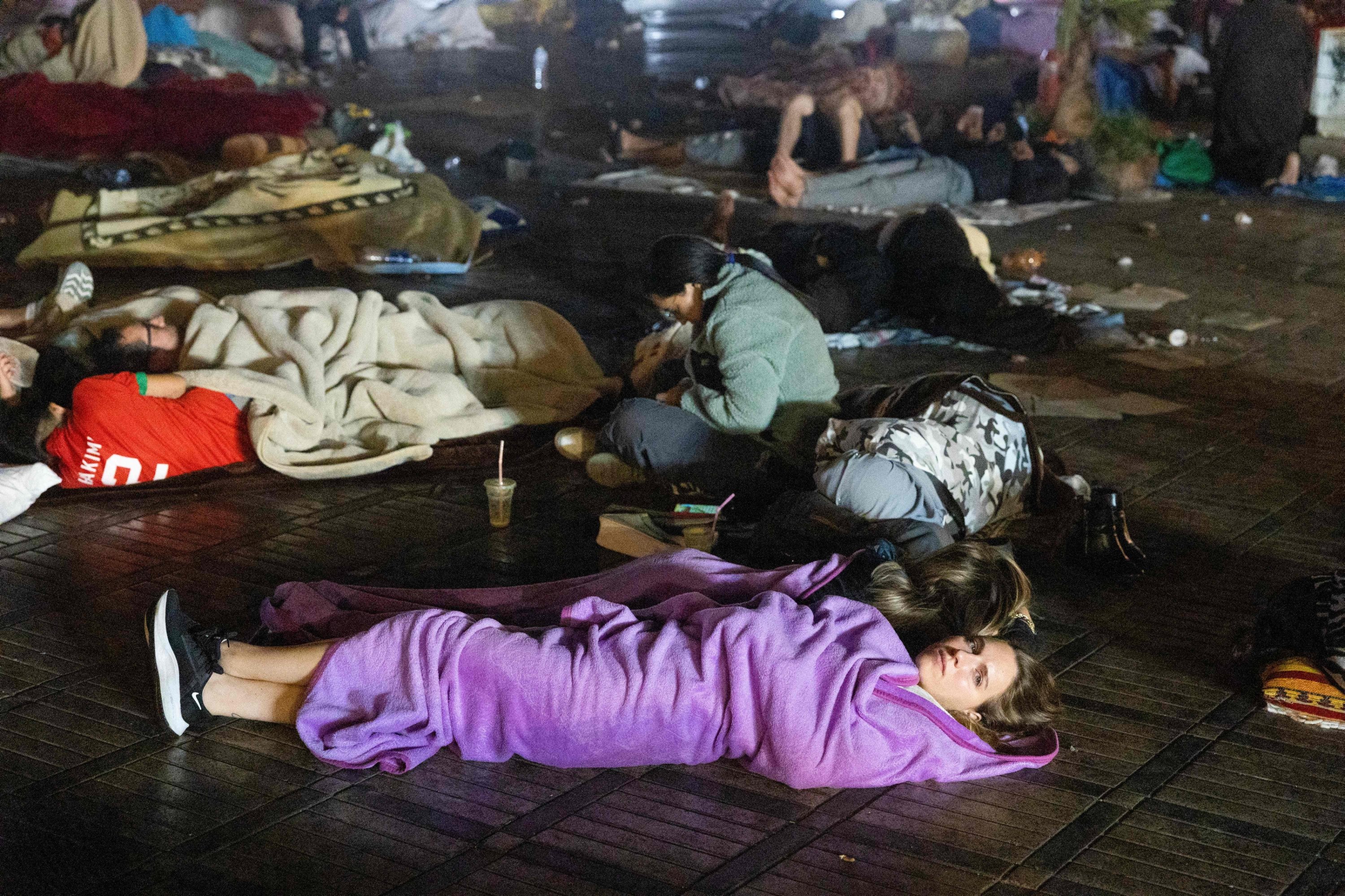 Residents stay out at a square following an earthquake in Marrakech, Morocco, Sept. 9, 2023. (AFP Photo)