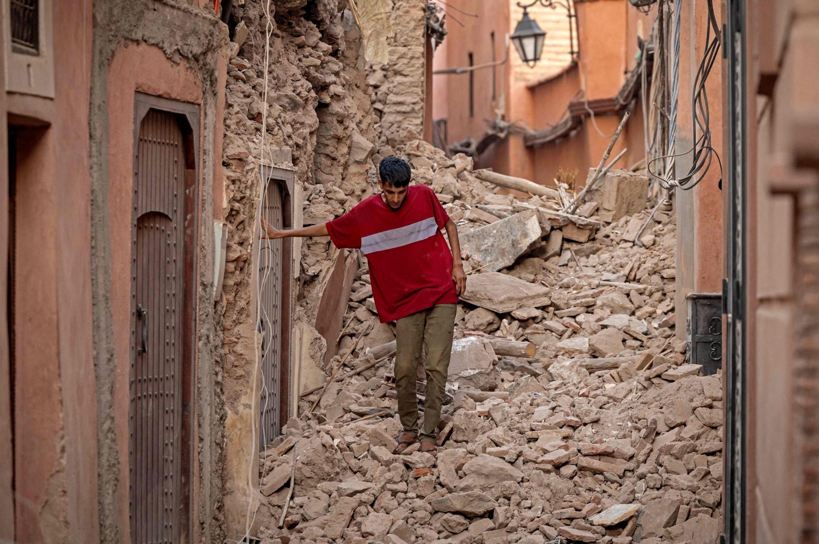 A resident navigates through the rubble following a 6.8-magnitude quake in Marrakech, Morocco, Sept. 9, 2023. (AFP Photo)