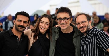 From L-R, Musab Ekici, Merve Dizdar, Nuri Bilge Ceylan and Deniz Celiloglu pose during a photocall for the film &quot;About Dry Grasses&quot; at the 76th edition of the Cannes Film Festival, Cannes, southern France, May 20, 2023. (AFP Photo)

