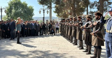 Parliament Speaker Numan Kurtulmuş is photographed in front of soldiers dressed as Ertuğrul's "alps'' during the ceremony in Bilecik, southwestern Türkiye, Sept. 10, 2023. (DHA Photo)