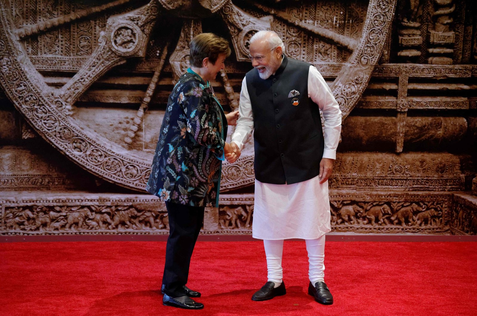 India&#039;s Prime Minister Narendra Modi (R) and International Monetary Fund (IMF) Managing Director Kristalina Georgieva shake hands ahead of the G-20 Leaders&#039; Summit at the Bharat Mandapam in New Delhi, India, Sept. 9, 2023. (AFP Photo)