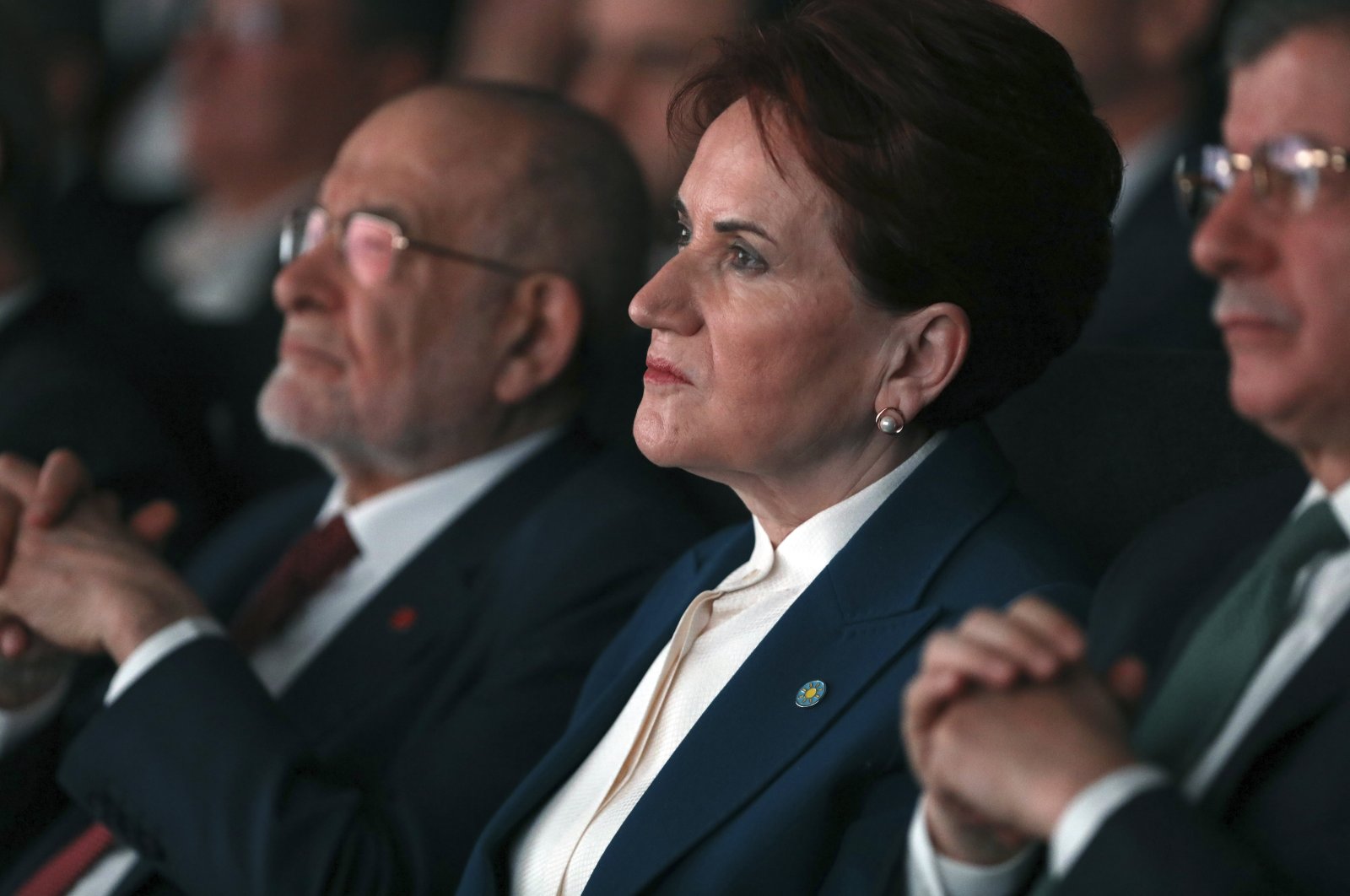 Good Party (IP) Chair Meral Akşener (C) listens as the opposition bloc known as the "table for six" presents their joint 240-page program, in Ankara, Türkiye, Jan. 30, 2023. (AP Photo)