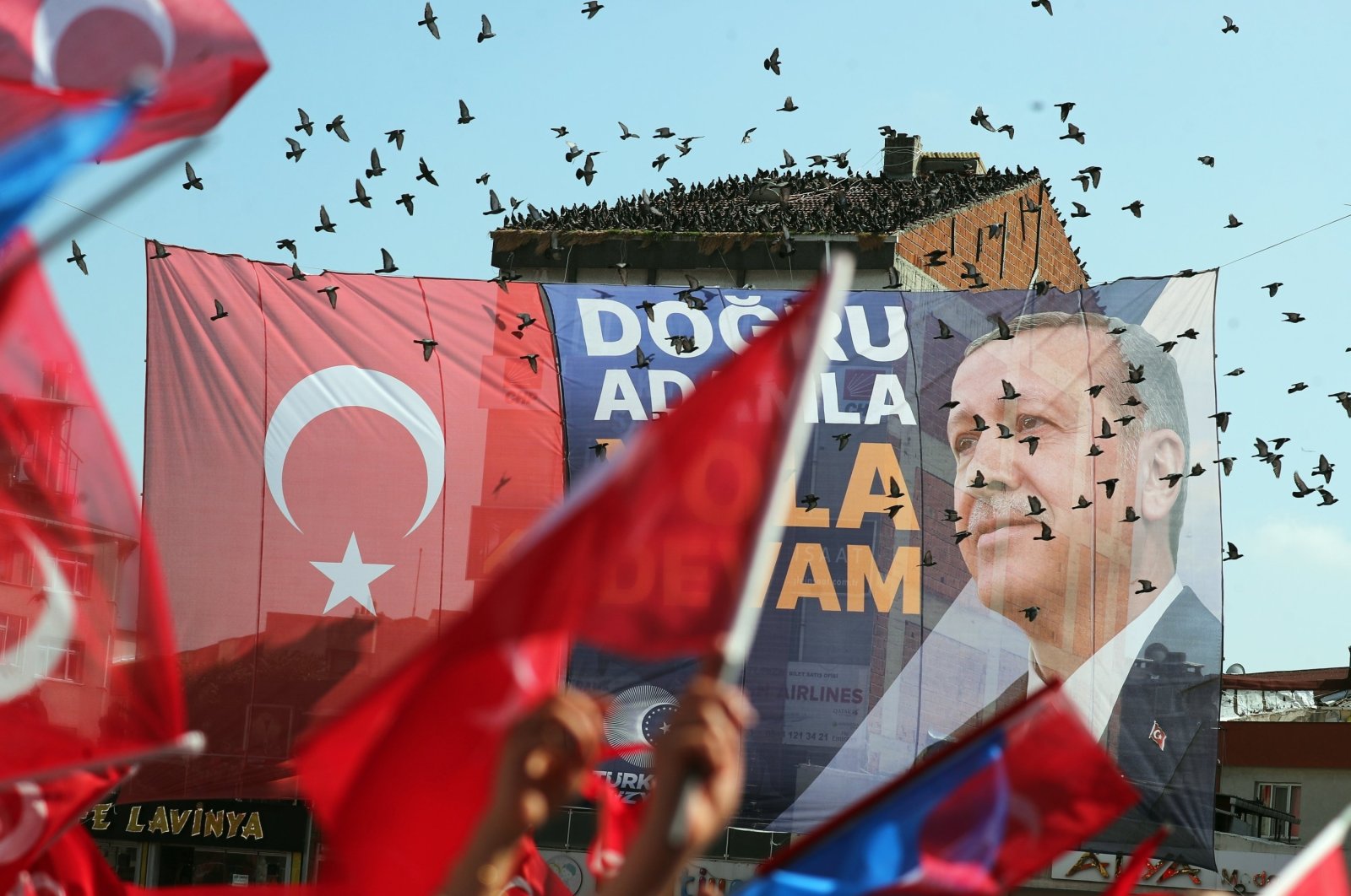 An election banner is seen as supporters of President Recep Tayyip Erdoğan gather for his election campaign rally prior to the second round of presidential elections in Istanbul, Türkiye, May 26, 2023. (EPA Photo)