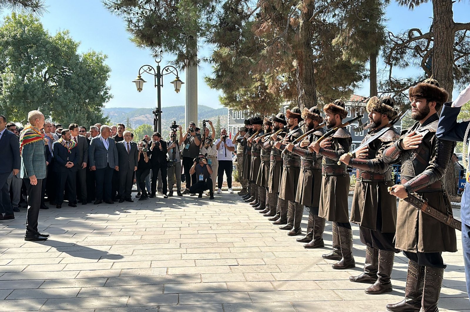 Parliament Speaker Numan Kurtulmuş is photographed in front of soldiers dressed as Ertuğrul&#039;s &quot;alps&#039;&#039; during the ceremony in Bilecik, southwestern Türkiye, Sept. 10, 2023. (DHA Photo)