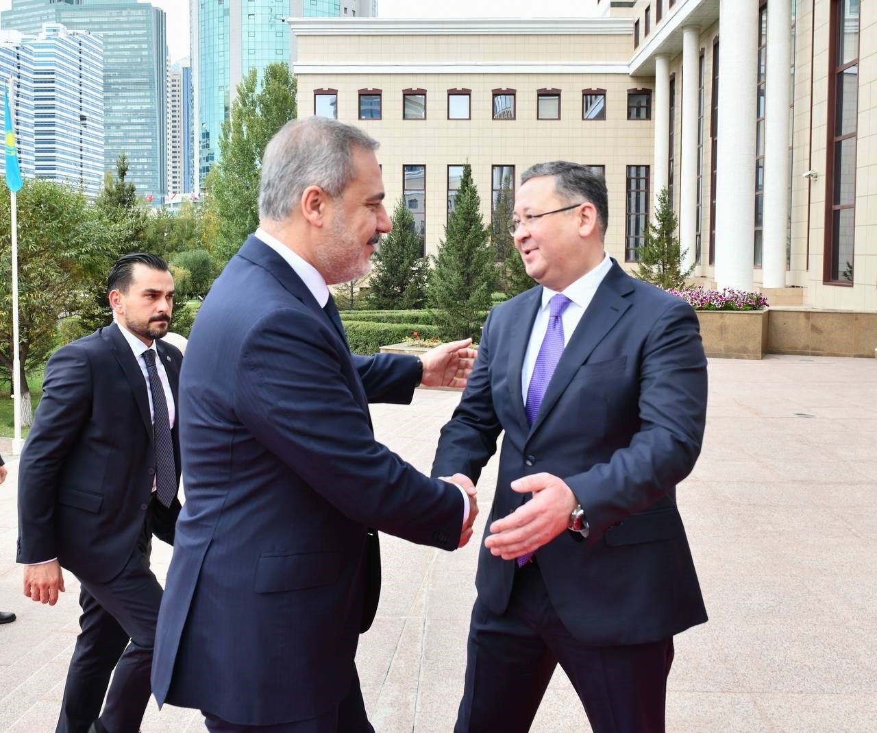Kazakh Foreign Minister Nurtleu (R) welcomes Foreign Minister Hakan Fidan, Astana, Kazakhstan, Sept. 11, 2023. (İHA Photo)