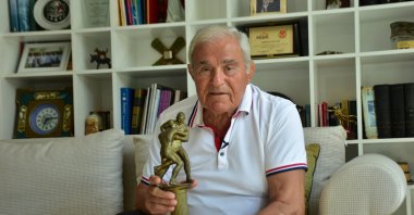 Turkish Wrestling Foundation co-founder and former athlete Ahmet Ayık poses with a trophy at his Champion Holiday Village in Kemer, Antalya, Türkiye, Sept. 8, 2023. (AA Photo)