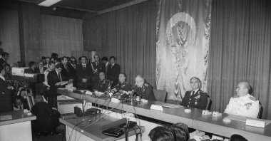 Military junta leader Kenan Evren (C) speaks to reporters at Parliament in the capital Ankara, Türkiye, Sept. 12, 1980. (AA Photo)