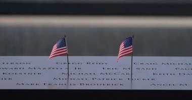 American flags line a memorial pool at the National Sept. 11 Memorial at the World Trade Center, New York, U.S., Sept. 11, 2023. (AFP Photo)