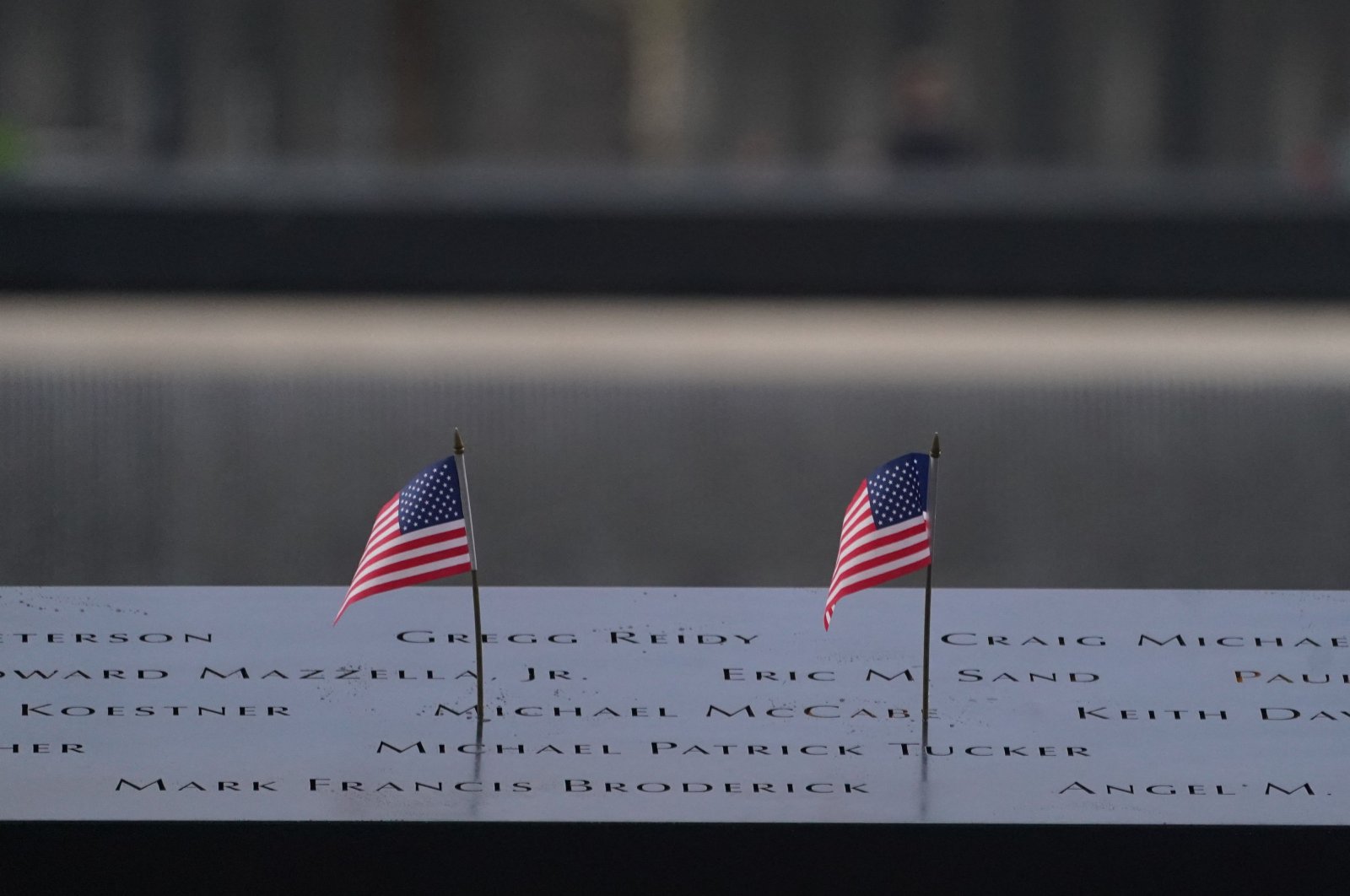 American flags line a memorial pool at the National Sept. 11 Memorial at the World Trade Center, New York, U.S., Sept. 11, 2023. (AFP Photo)